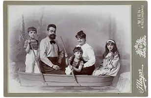 A family sitting in a boat