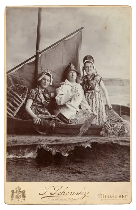 Three people on a small boat